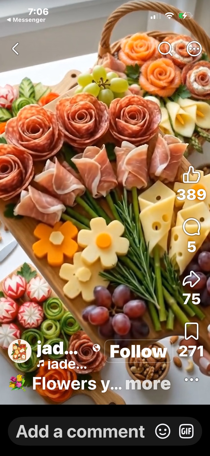 Salami roses, folded prosciutto, cheese flowers, and fresh fruit.